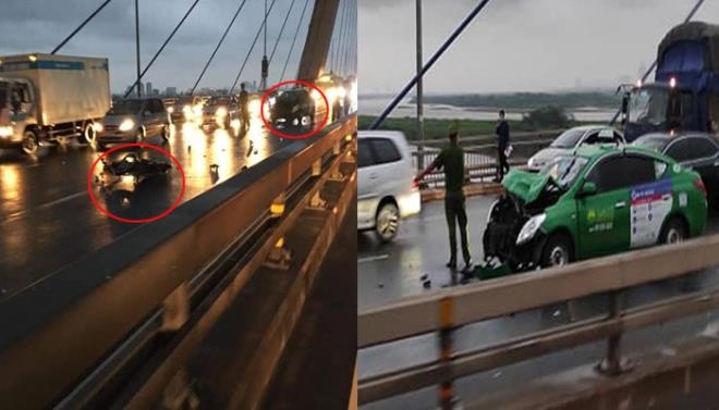 Xe máy đi ngược chiều tông trúng taxi trên cầu Nhật Tân, 2 thanh niên nguy kịch